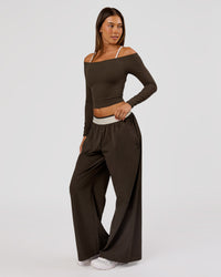 Woman wearing Stride Wide Leg Pant - Ground Coffee | Model:Charli | Size:XS | Thumbnail Index: 0