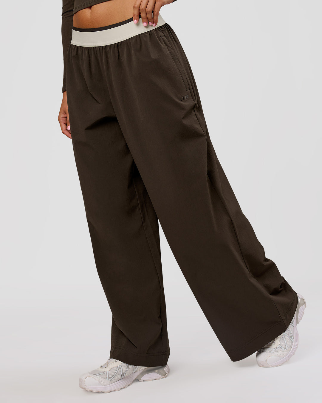 Woman wearing Stride Wide Leg Pant - Ground Coffee | Model:Charli | Size:XS - view 3