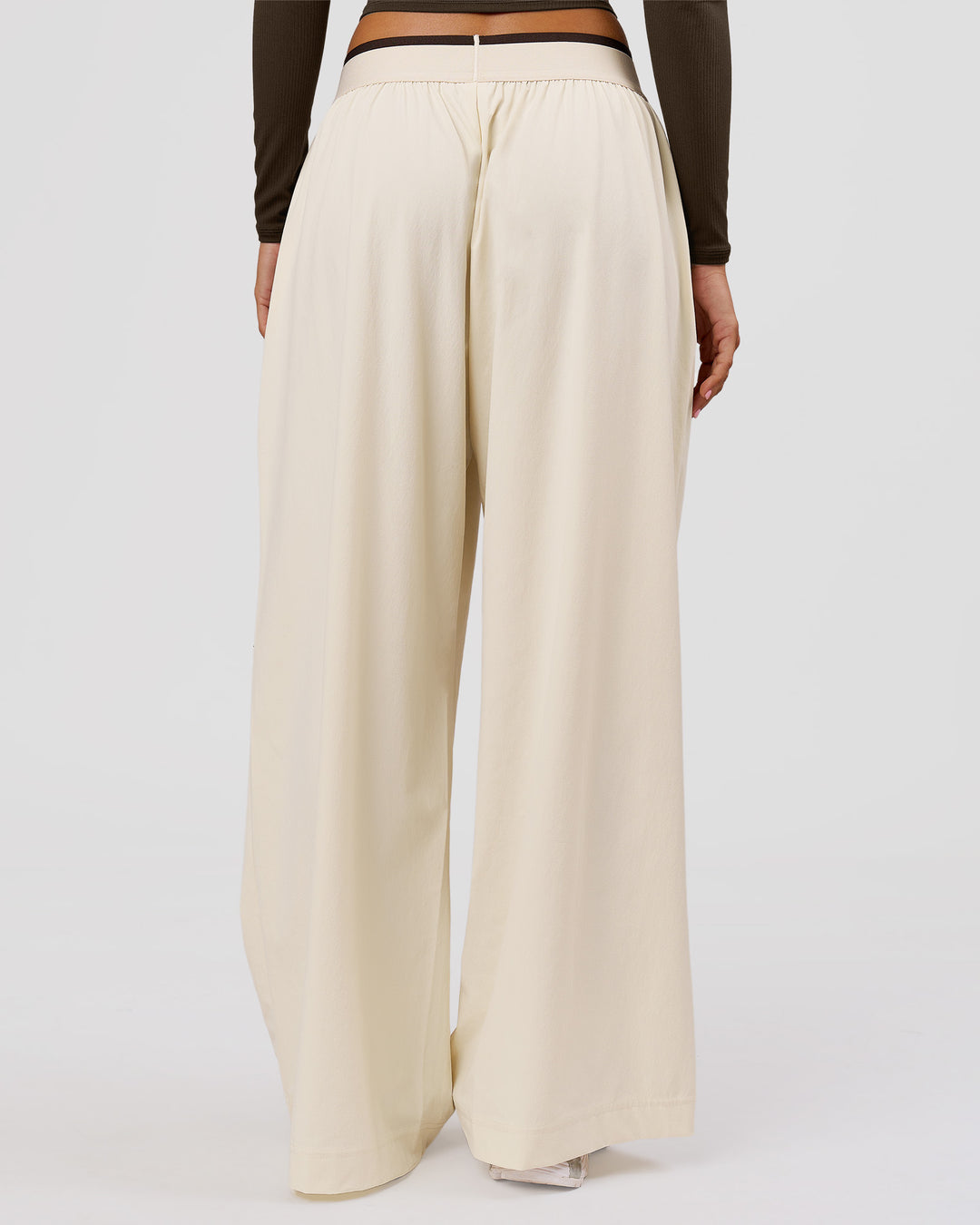 Woman wearing Stride Wide Leg Pant - Vanilla Bean | Model:Charli | Size:XS - view 3