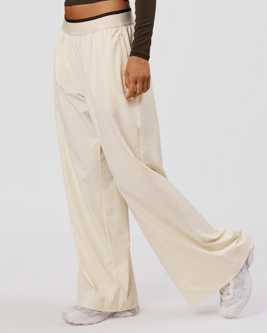 Woman wearing Stride Wide Leg Pant - Vanilla Bean | Model:Charli | Size:XS - view 4