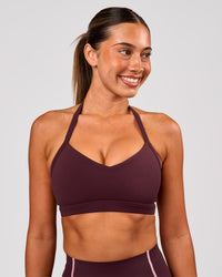 Woman wearing Unleash Sports Bra - Cherry Lacquer | Model:Charli | Size:XS | Thumbnail Index: 2