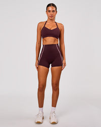 Woman wearing Unleash Sports Bra - Cherry Lacquer | Model:Charli | Size:XS | Thumbnail Index: 3