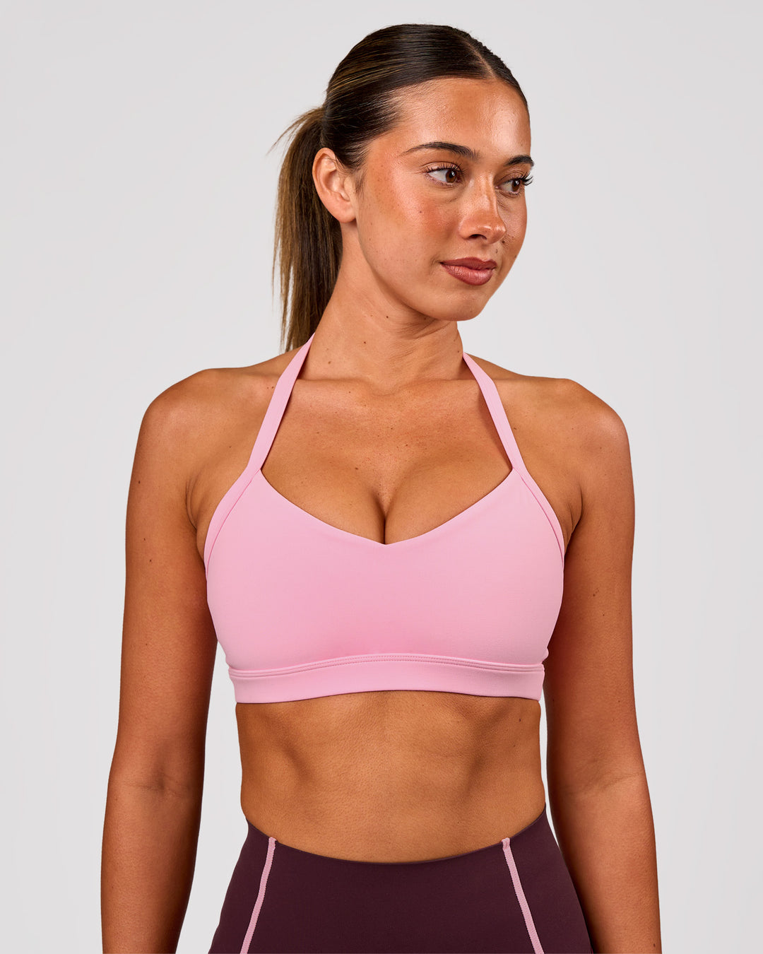 Woman wearing Unleash Sports Bra - Pink Rose | Model:Charli | Size:XS - view 3