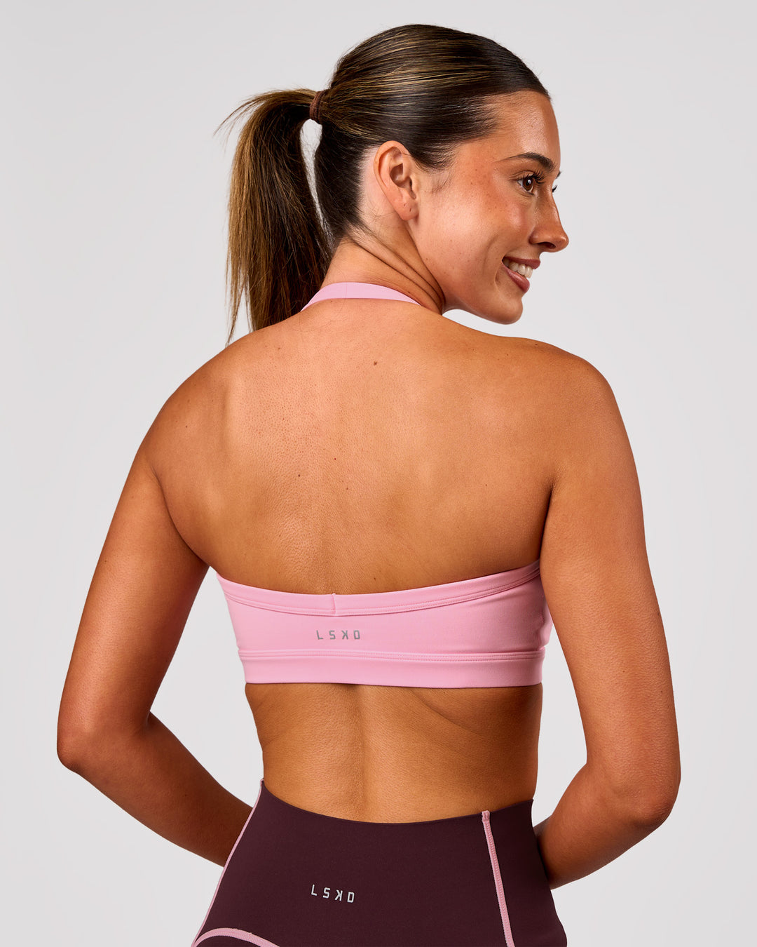 Woman wearing Unleash Sports Bra - Pink Rose | Model:Charli | Size:XS - view 4