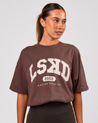 Woman wearing Varsity EST Heavyweight Oversized Tee  - Cocoa Powder-Off White | Model:Charli | Size:XS | Thumbnail Index: 6
