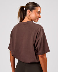 Woman wearing Varsity EST Heavyweight Oversized Tee  - Cocoa Powder-Off White | Model:Charli | Size:XS | Thumbnail Index: 7