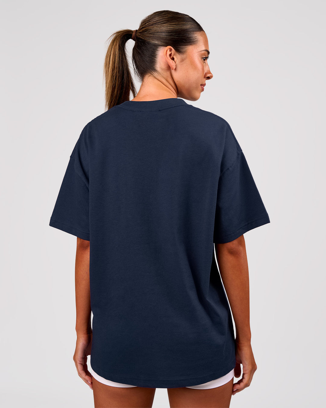 Woman wearing Varsity EST Heavyweight Oversized Tee  - Future Navy-White | Model:Charli | Size:XS - view 4