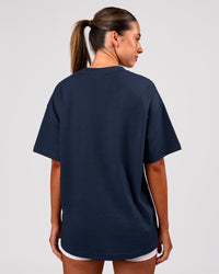 Woman wearing Varsity EST Heavyweight Oversized Tee  - Future Navy-White | Model:Charli | Size:XS | Thumbnail Index: 3