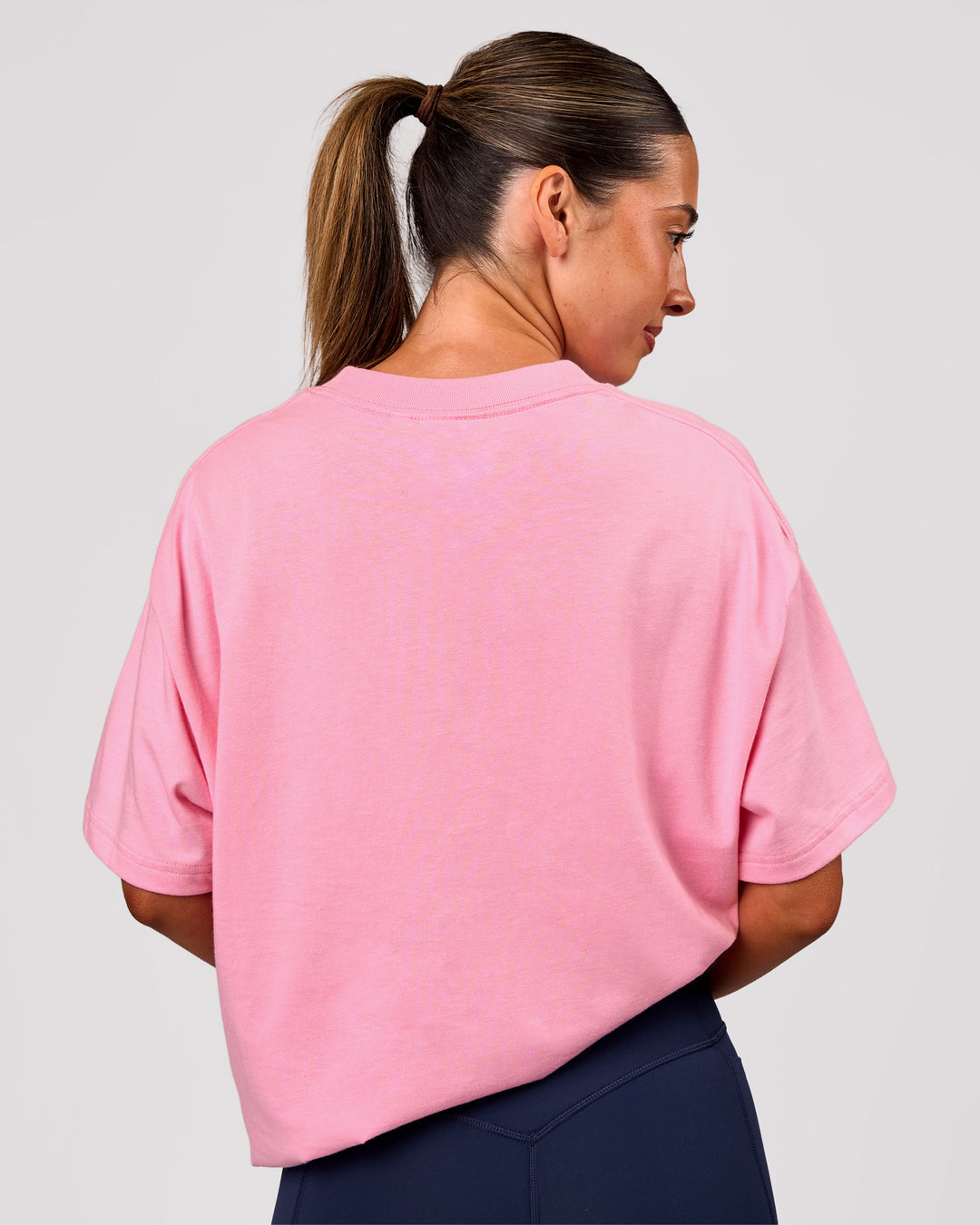 Woman wearing Varsity EST Heavyweight Oversized Tee  - Pink Rose-Future Navy | Model:Charli | Size:XS - view 4