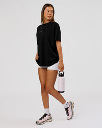 Woman wearing VS26 Journey FLXCotton Oversize Tee - Black-White | Model:Charli | Size:XS | Thumbnail Index: 16
