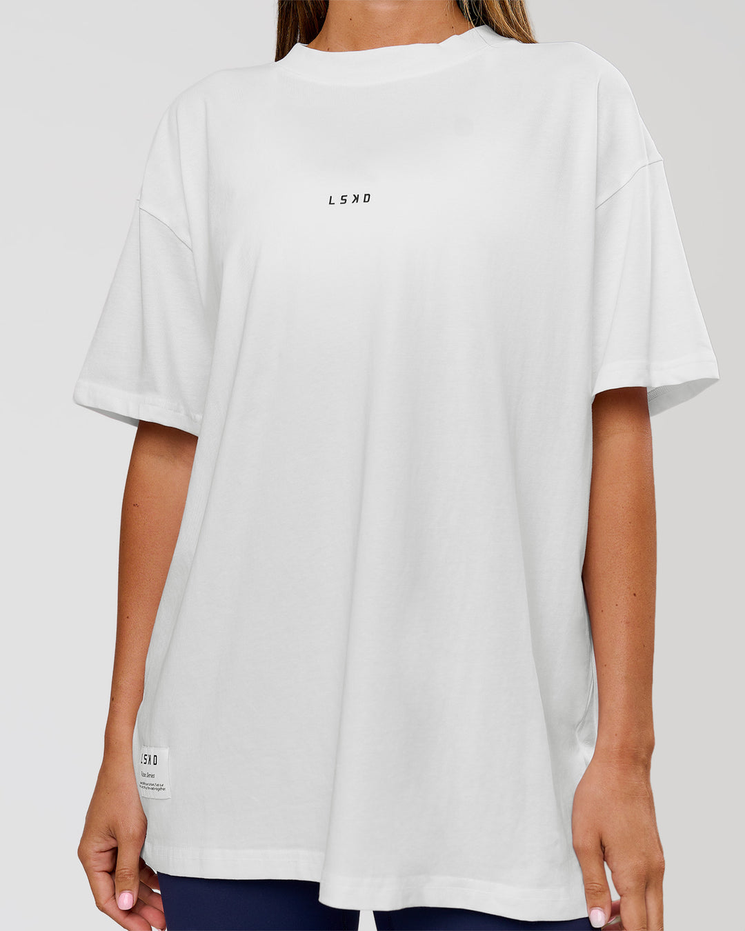 Woman wearing VS26 Journey FLXCotton Oversize Tee - White-Black | Model:Charli | Size:XS - view 14