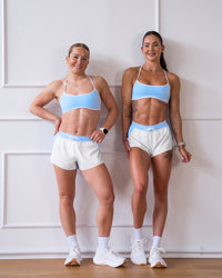 Woman wearing Strong is Beautiful Sports Bra - Open Air-White | Model:Charlotte | Size:XS | Thumbnail Index: 10