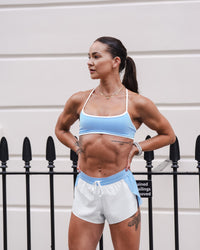 Woman wearing Strong is Beautiful Sports Bra - Open Air-White | Model:Charlotte | Size:XS | Thumbnail Index: 12