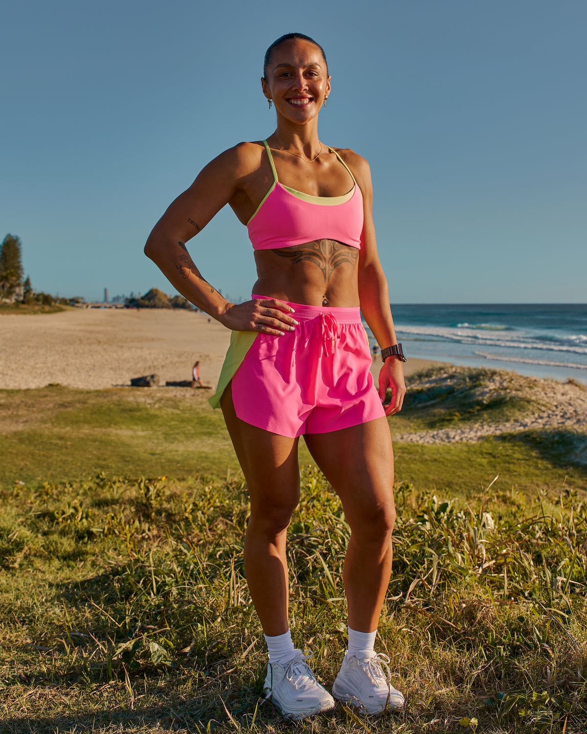 Woman wearing Accelerate 3" High-Rise Running Short - Lime Glo-Sugar Plum | Model:Chelsea | Size:XS