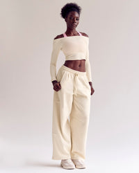 Woman wearing Bree Barrel Fleece Track Pant - Vanilla Bean | Model:Desleigh | Size:XS | Thumbnail Index: 2