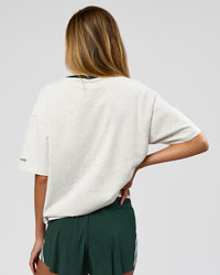 Woman wearing Be Here Now Heavyweight FLXCotton Tee Oversize - Silver Marl-Midnight Green | Model:Georgia | Size:XS | Thumbnail Index: 9