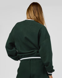 Woman wearing Go-To Dual Oversized Sweater - Midnight Green-White | Model:Georgia | Size:XS | Thumbnail Index: 5