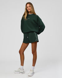 Woman wearing Go-To Dual Oversized Sweater - Midnight Green-White | Model:Georgia | Size:XS | Thumbnail Index: 9