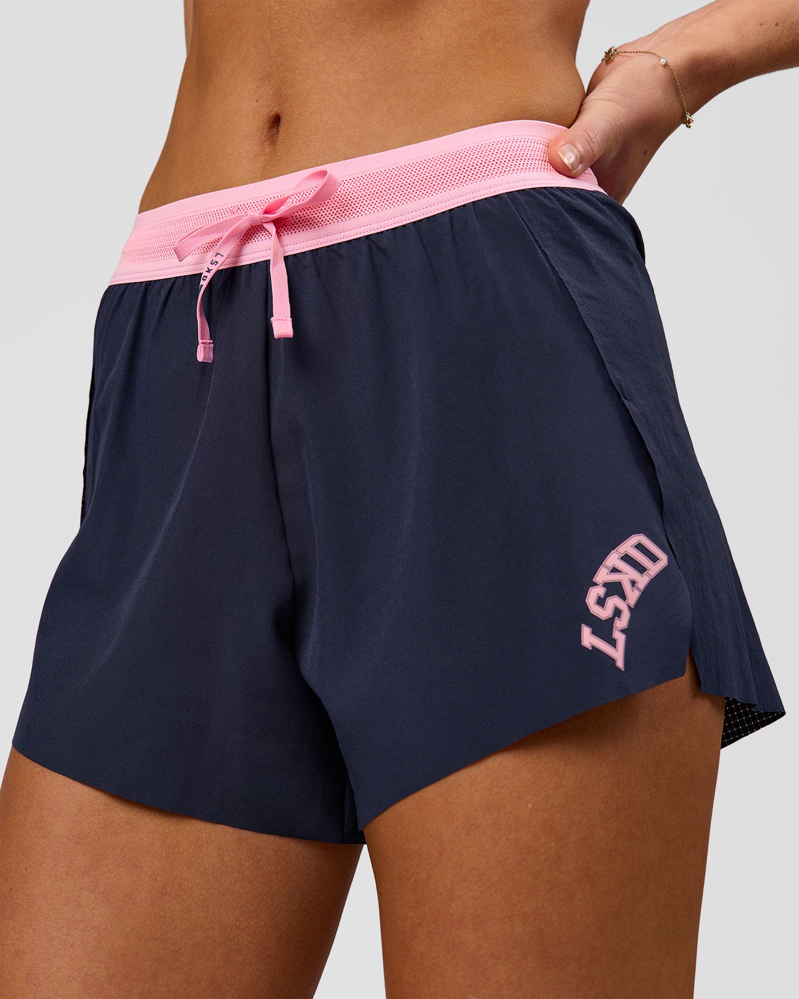 Woman wearing Accelerate 3" High-Rise Running Short - Future Navy-Varsity print | Model:Issy | Size:XS