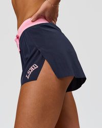 Woman wearing Accelerate 3" High-Rise Running Short - Future Navy-Varsity print | Model:Issy | Size:XS | Thumbnail Index: 6