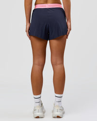 Woman wearing Accelerate 3" High-Rise Running Short - Future Navy-Varsity print | Model:Issy | Size:XS | Thumbnail Index: 7