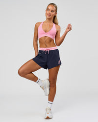 Woman wearing Accelerate 3" High-Rise Running Short - Future Navy-Varsity print | Model:Issy | Size:XS | Thumbnail Index: 10