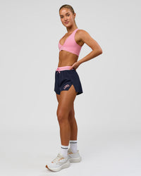 Woman wearing Accelerate 3" High-Rise Running Short - Future Navy-Varsity print | Model:Issy | Size:XS | Thumbnail Index: 11