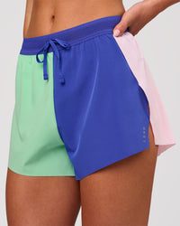Woman wearing Accelerate 3" High-Rise Running Short - Power Cobalt-Prism | Model:Issy | Size:XS | Thumbnail Index: 9