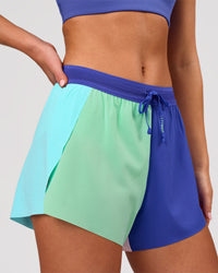 Woman wearing Accelerate 3" High-Rise Running Short - Power Cobalt-Prism | Model:Issy | Size:XS | Thumbnail Index: 7