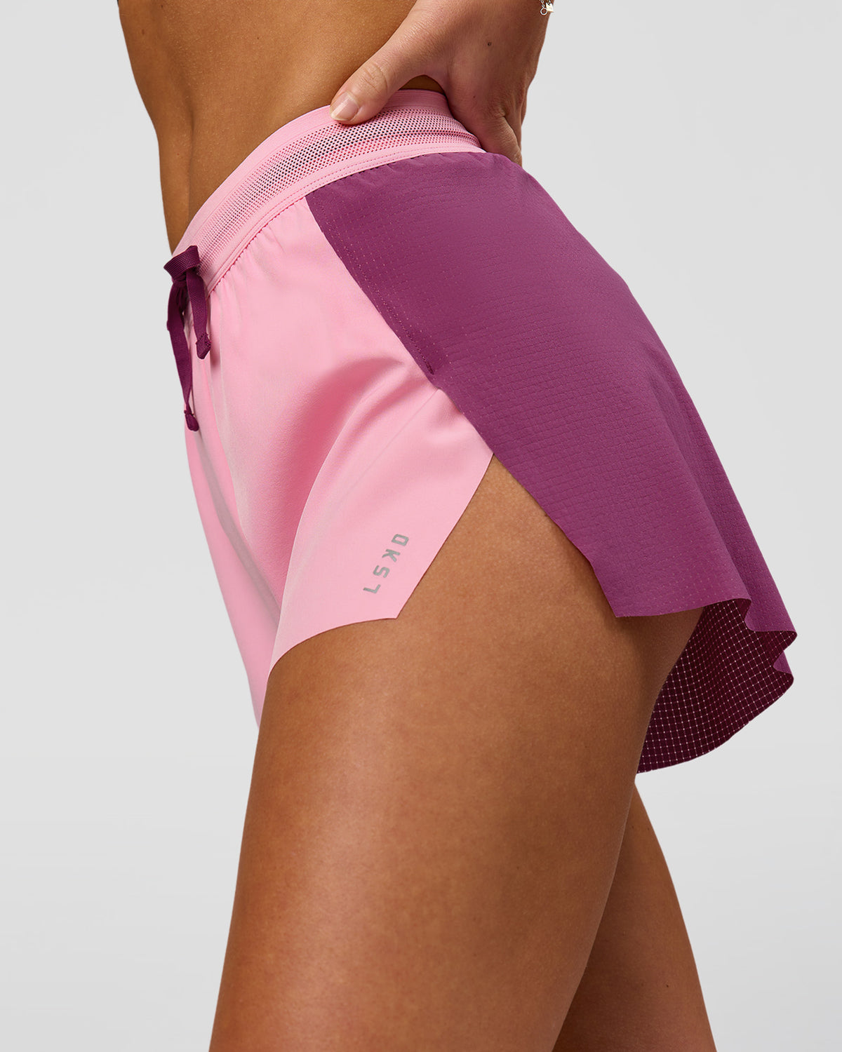 Woman wearing Accelerate 3" High-Rise Running Short - Boysenberry-Pink Rose | Model:Issy | Size:XS