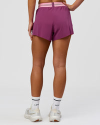 Woman wearing Accelerate 3" High-Rise Running Short - Boysenberry-Pink Rose | Model:Issy | Size:XS | Thumbnail Index: 2