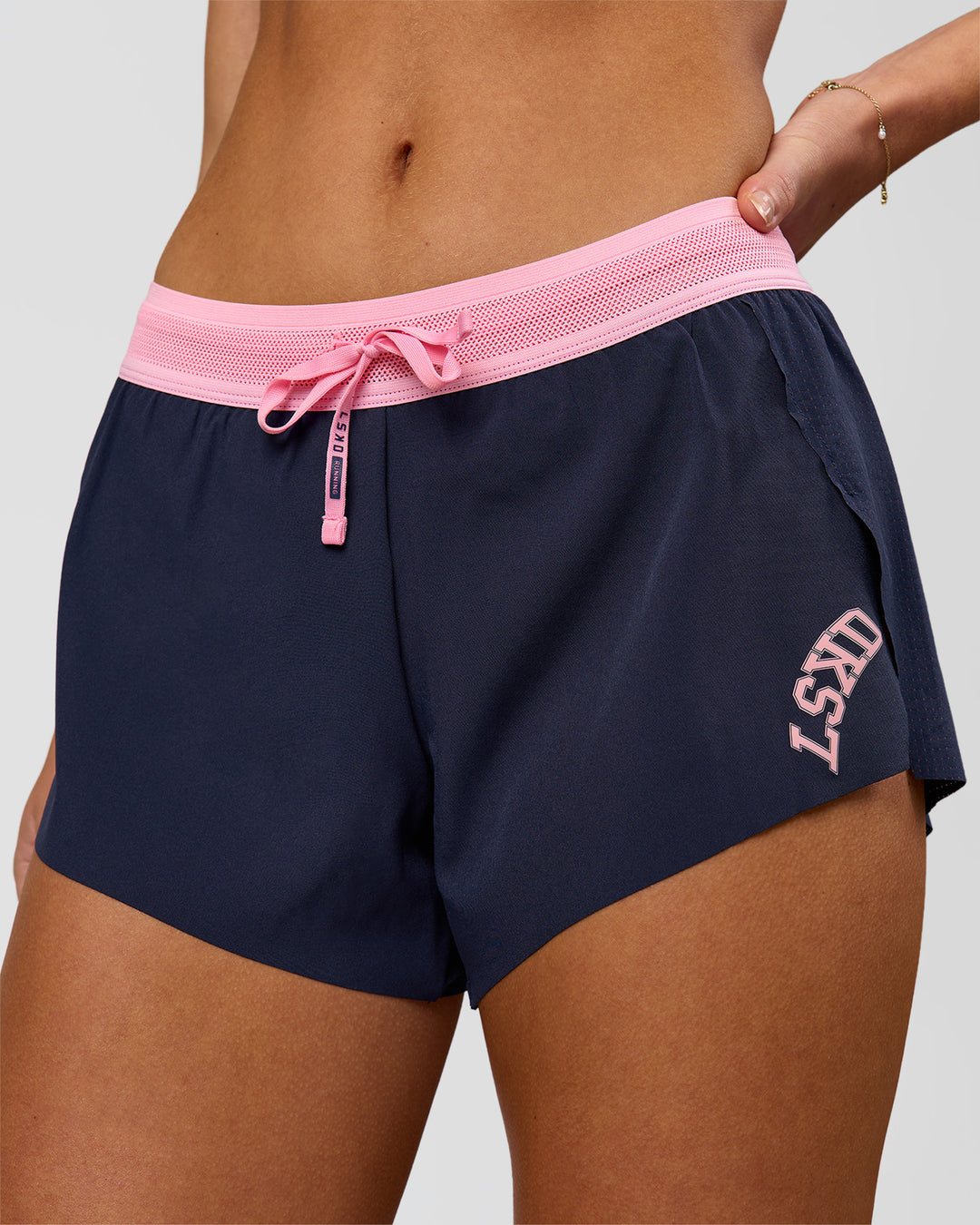 Woman wearing Accelerate 3" Mid-Rise Running Short - Future Navy-Varsity Print | Model:Issy | Size:XS - view 2