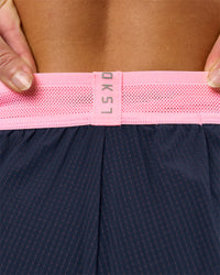 Woman wearing Accelerate 3" Mid-Rise Running Short - Future Navy-Varsity Print | Model:Issy | Size:XS | Thumbnail Index: 10