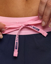 Woman wearing Accelerate 3" Mid-Rise Running Short - Future Navy-Varsity Print | Model:Issy | Size:XS | Thumbnail Index: 11
