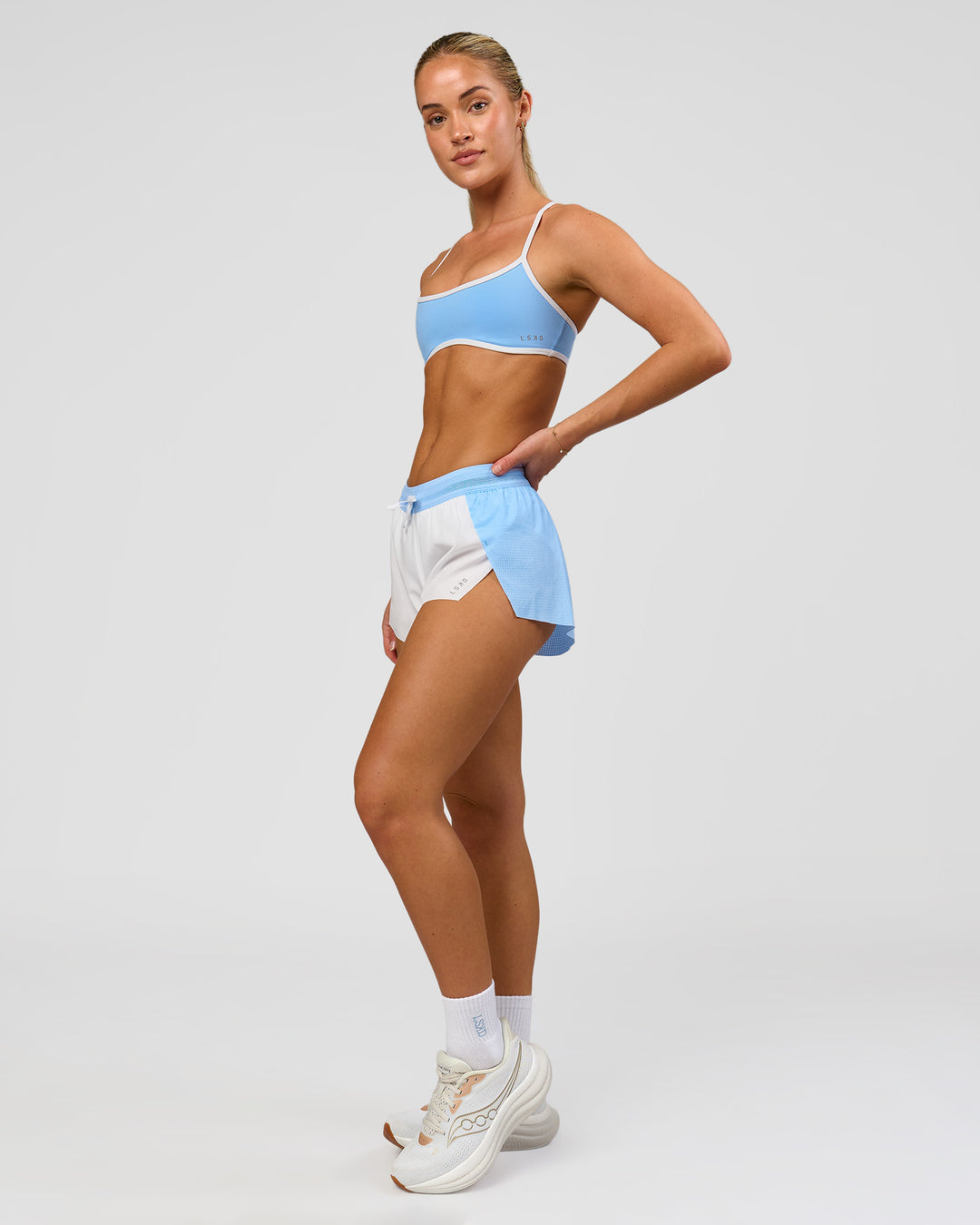 Woman wearing Accelerate 3" Mid-Rise Running Short - Open Air-White | Model:Issy | Size:XS - view 11