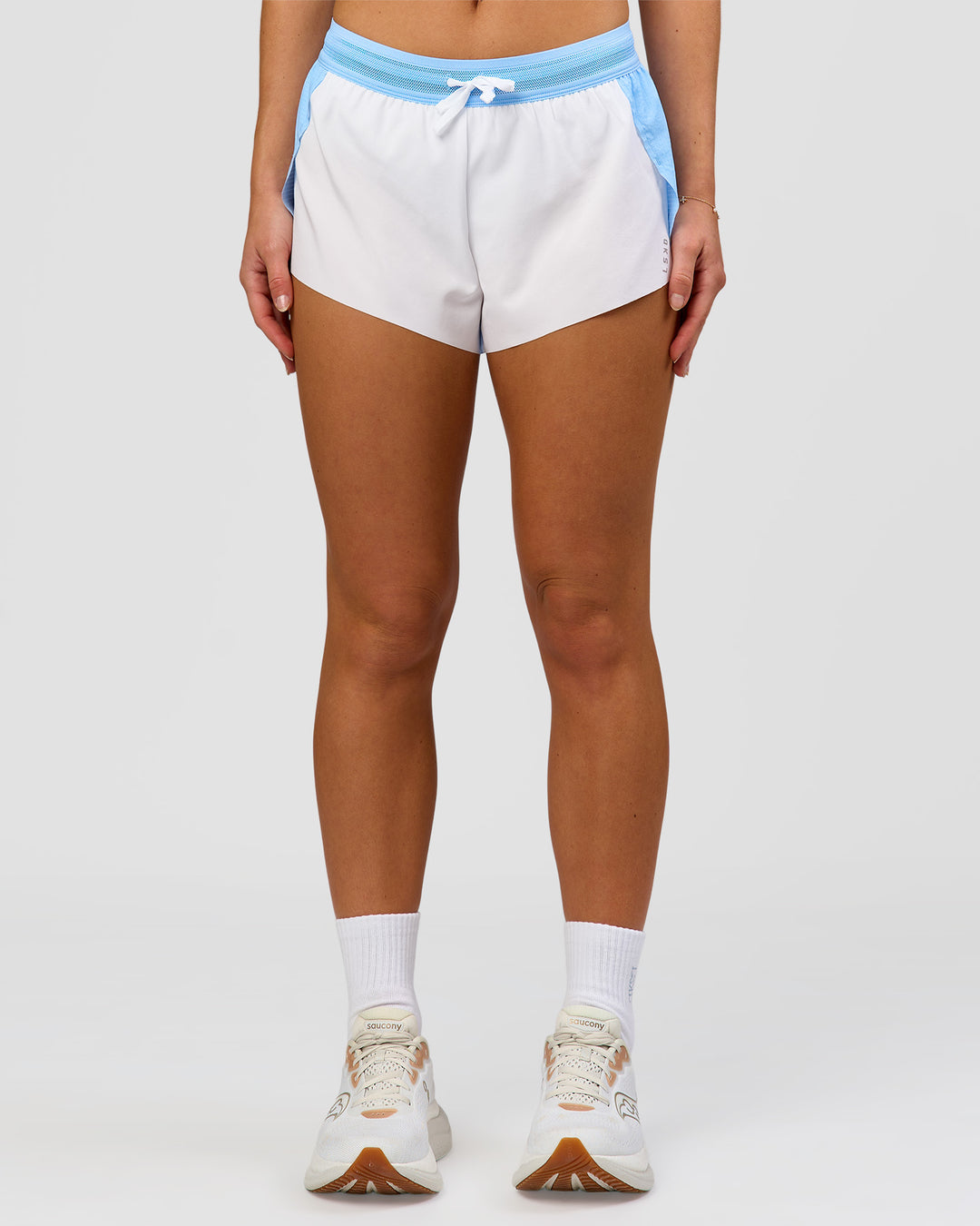 Woman wearing Accelerate 3" Mid-Rise Running Short - Open Air-White | Model:Issy | Size:XS - view 5