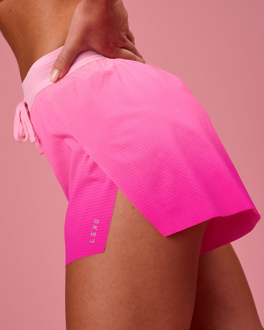 Woman wearing Accelerate Gradient 3" High-Rise Running Short - Pink Rose-Ultra Pink Gradient | Model:Issy | Size:XS - view 3
