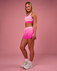Woman wearing Accelerate Gradient 3" High-Rise Running Short - Pink Rose-Ultra Pink Gradient | Model:Issy | Size:XS | Thumbnail Index: 5