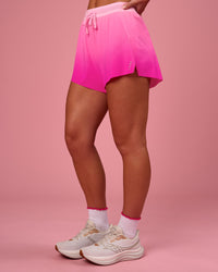 Woman wearing Accelerate Gradient 3" High-Rise Running Short - Pink Rose-Ultra Pink Gradient | Model:Issy | Size:XS | Thumbnail Index: 6