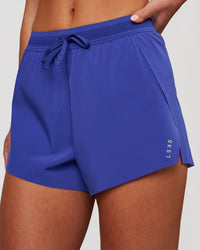 Woman wearing Accelerate 3" High-Rise Running Short - Power Cobalt | Model:Issy | Size:XS | Thumbnail Index: 0