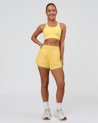 Woman wearing Accelerate Sports Bra - Lemon | Model:Issy | Size:XS | Thumbnail Index: 3