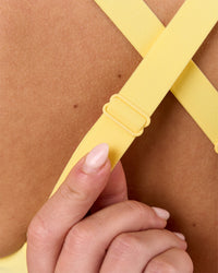 Woman wearing Accelerate Sports Bra - Lemon | Model:Issy | Size:XS | Thumbnail Index: 6