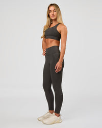 Woman wearing Accelerate Sports Bra - Onyx | Model:Issy | Size:XS | Thumbnail Index: 5