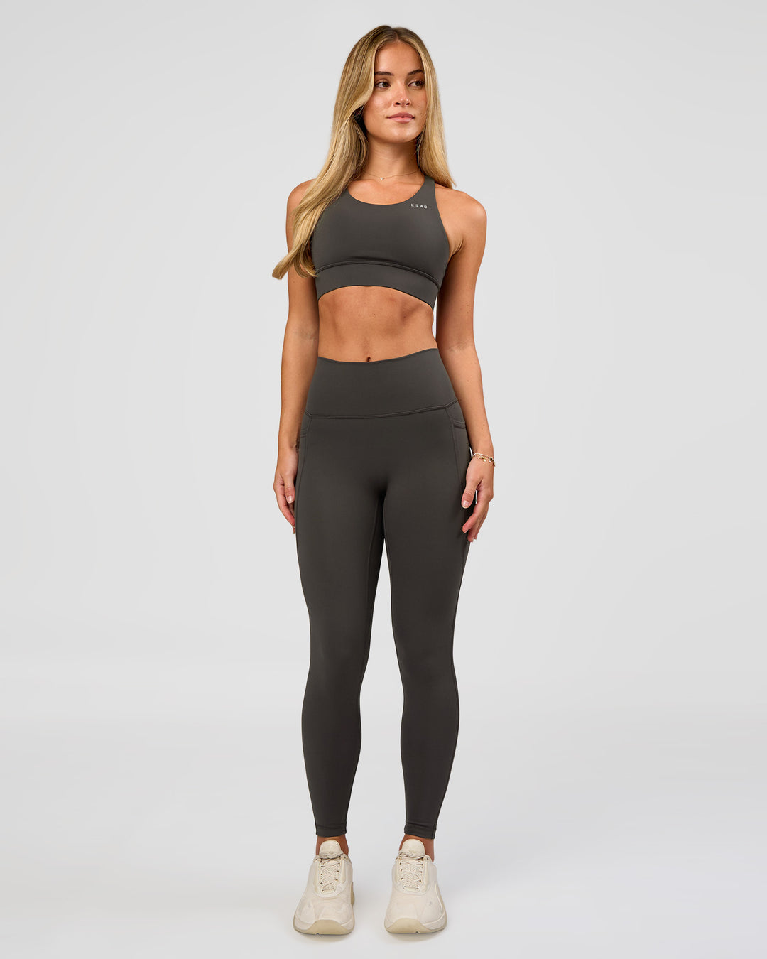 Woman wearing Accelerate Sports Bra - Onyx | Model:Issy | Size:XS - view 7