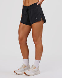 Woman wearing Accelerate Synergy 3" Running Short Short - Black-Black | Model:Issy | Size:XS | Thumbnail Index: 1
