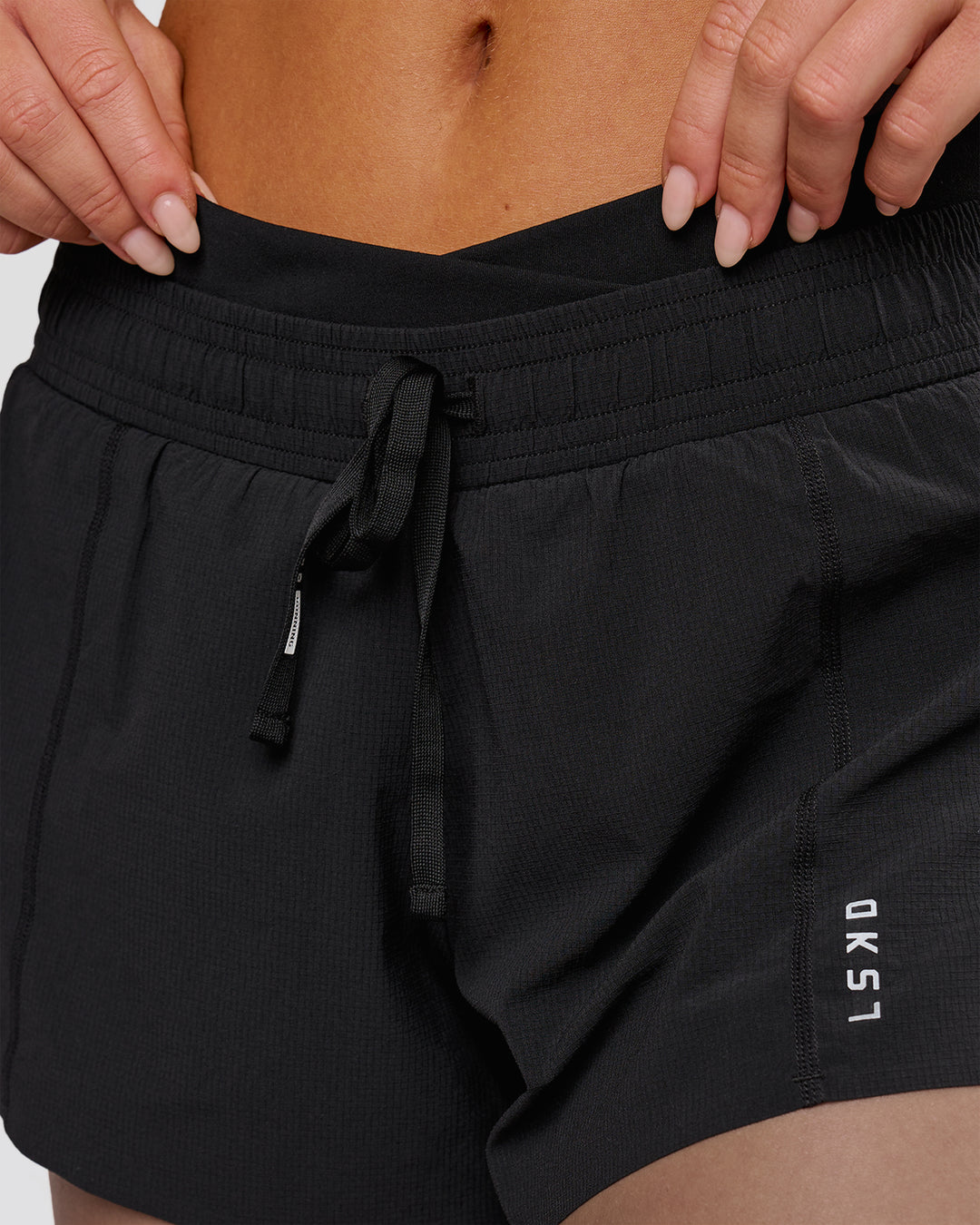 Woman wearing Accelerate Synergy 3" Running Short Short - Black-Black | Model:Issy | Size:XS - view 5