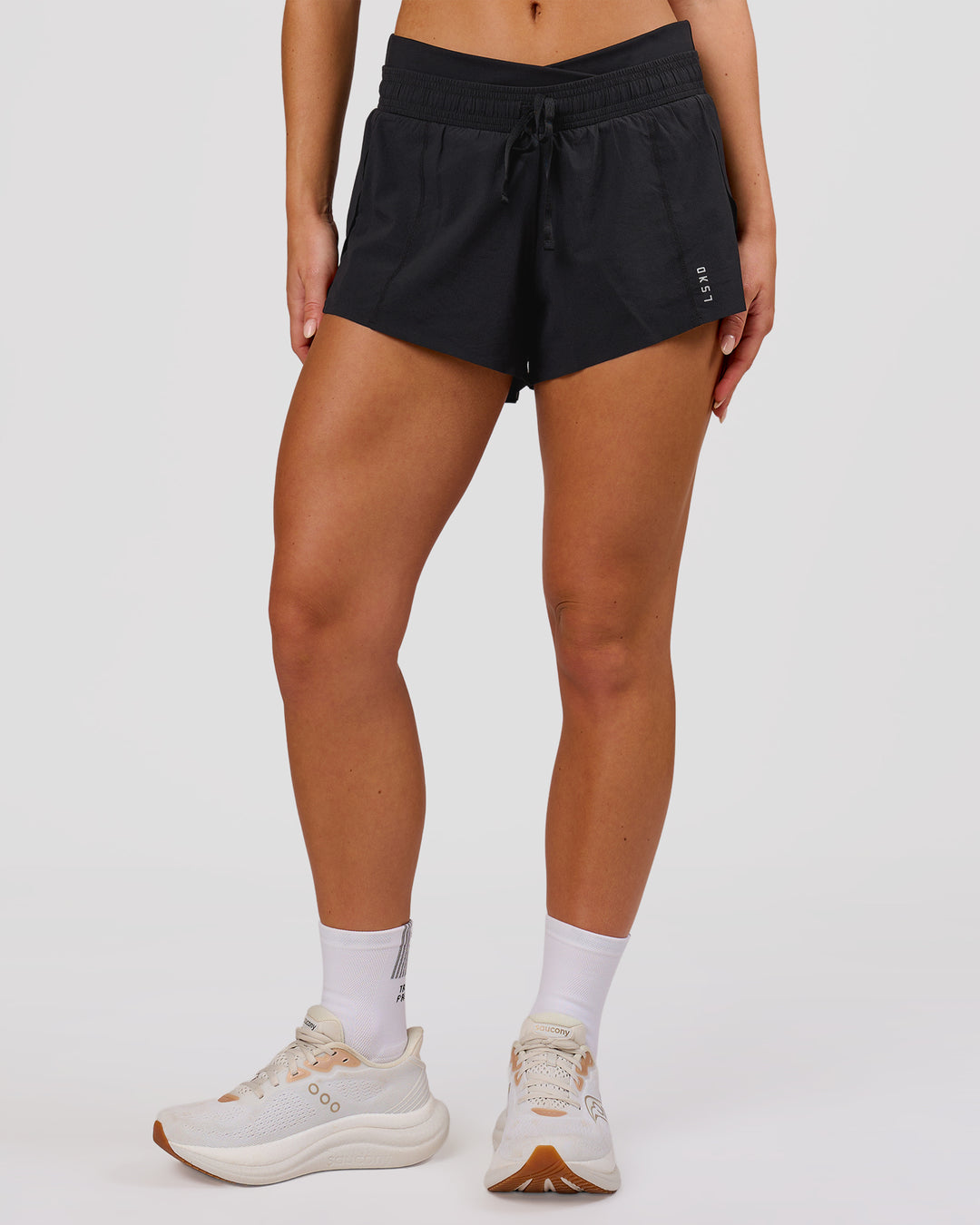 Woman wearing Accelerate Synergy 3" Running Short Short - Black-Black | Model:Issy | Size:XS - view 6