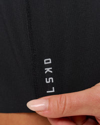 Woman wearing Accelerate Synergy 3" Running Short Short - Black-Black | Model:Issy | Size:XS | Thumbnail Index: 14