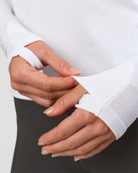 Woman wearing AeroFLX+ Seamless Long Sleeve Tee - White/White | Model:Issy | Size:XS | Thumbnail Index: 3