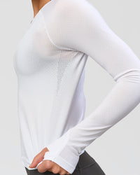 Woman wearing AeroFLX+ Seamless Long Sleeve Tee - White/White | Model:Issy | Size:XS | Thumbnail Index: 5